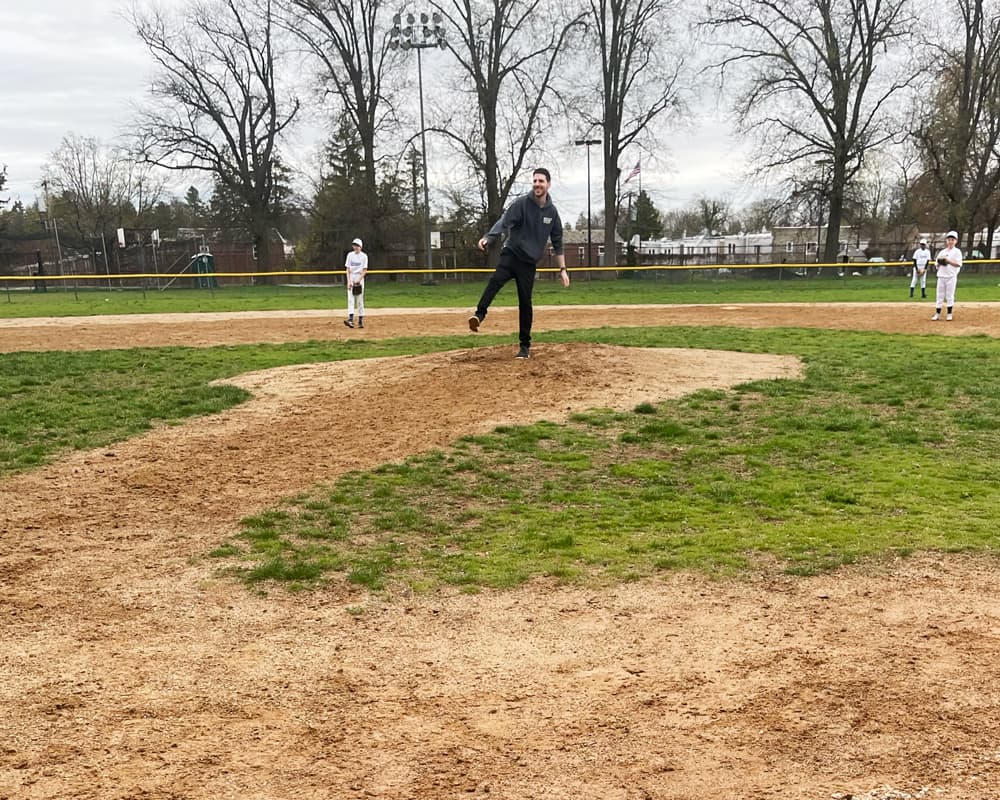 Matthew throwing the first pitch
